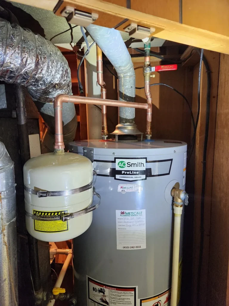 New AO Smith ProLine water heater with new venting and expansion tank installed to code