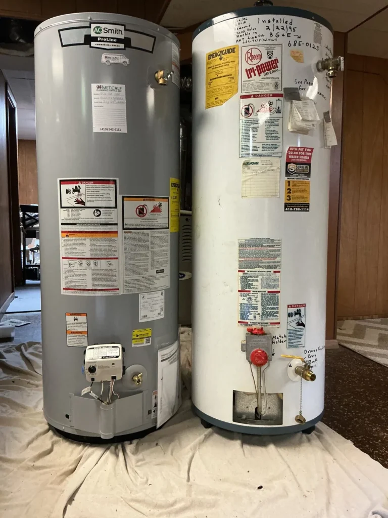 The 1995 Rheem water heater beside the new AO Smith ProLine replacement