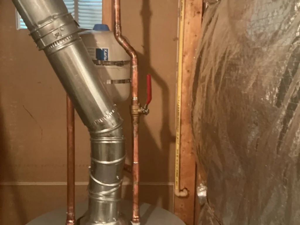 Metcalf plumber servicing a residential water heater